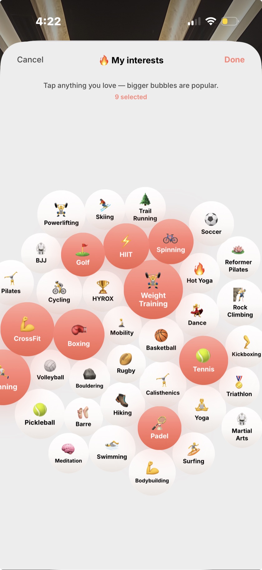 The Compa interests picker — a full cloud of tappable activity bubbles, several lit coral, under a 'Tap anything you love' header.